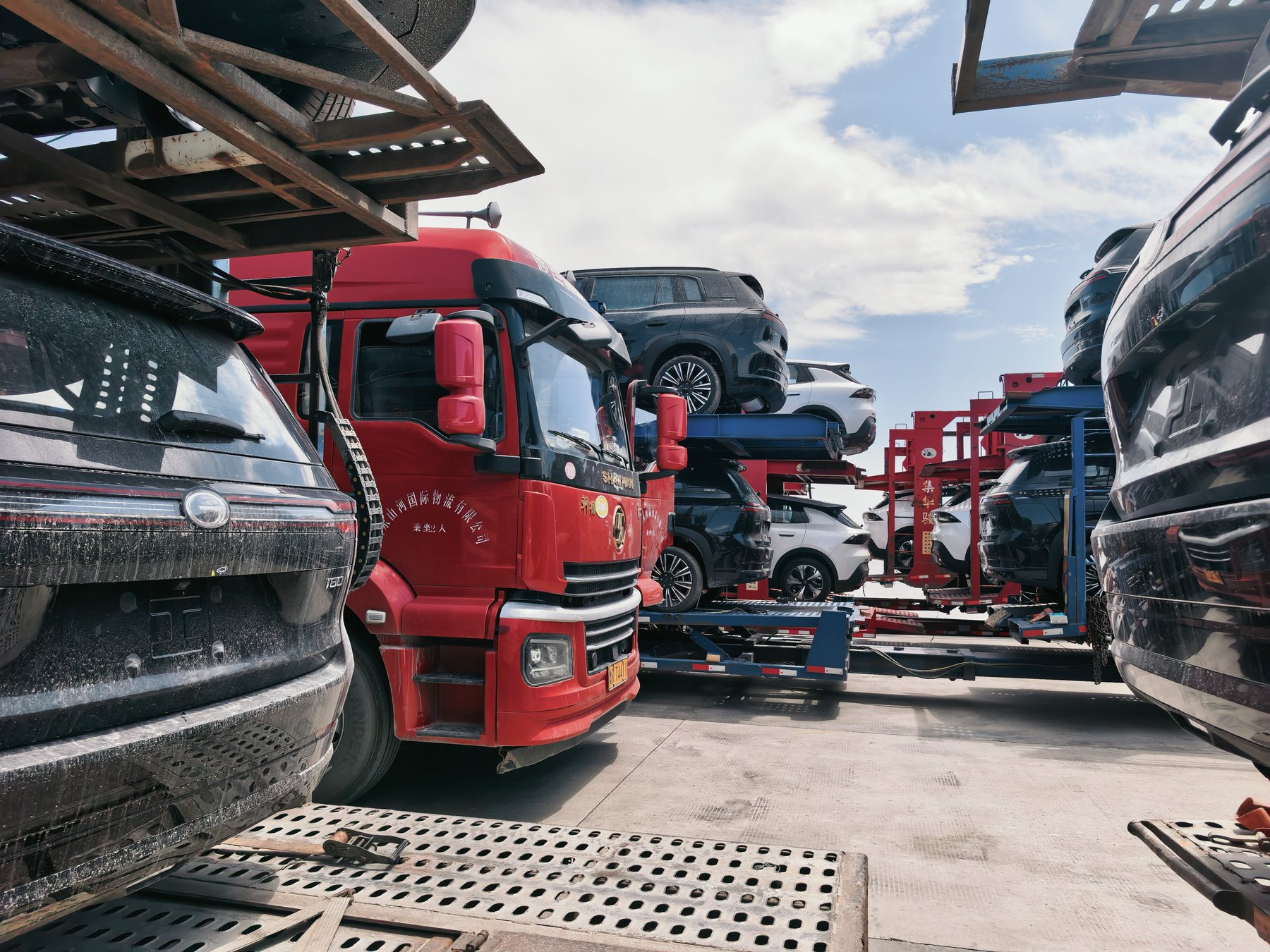 Loaded car carriers and export vehicles in an operating yard