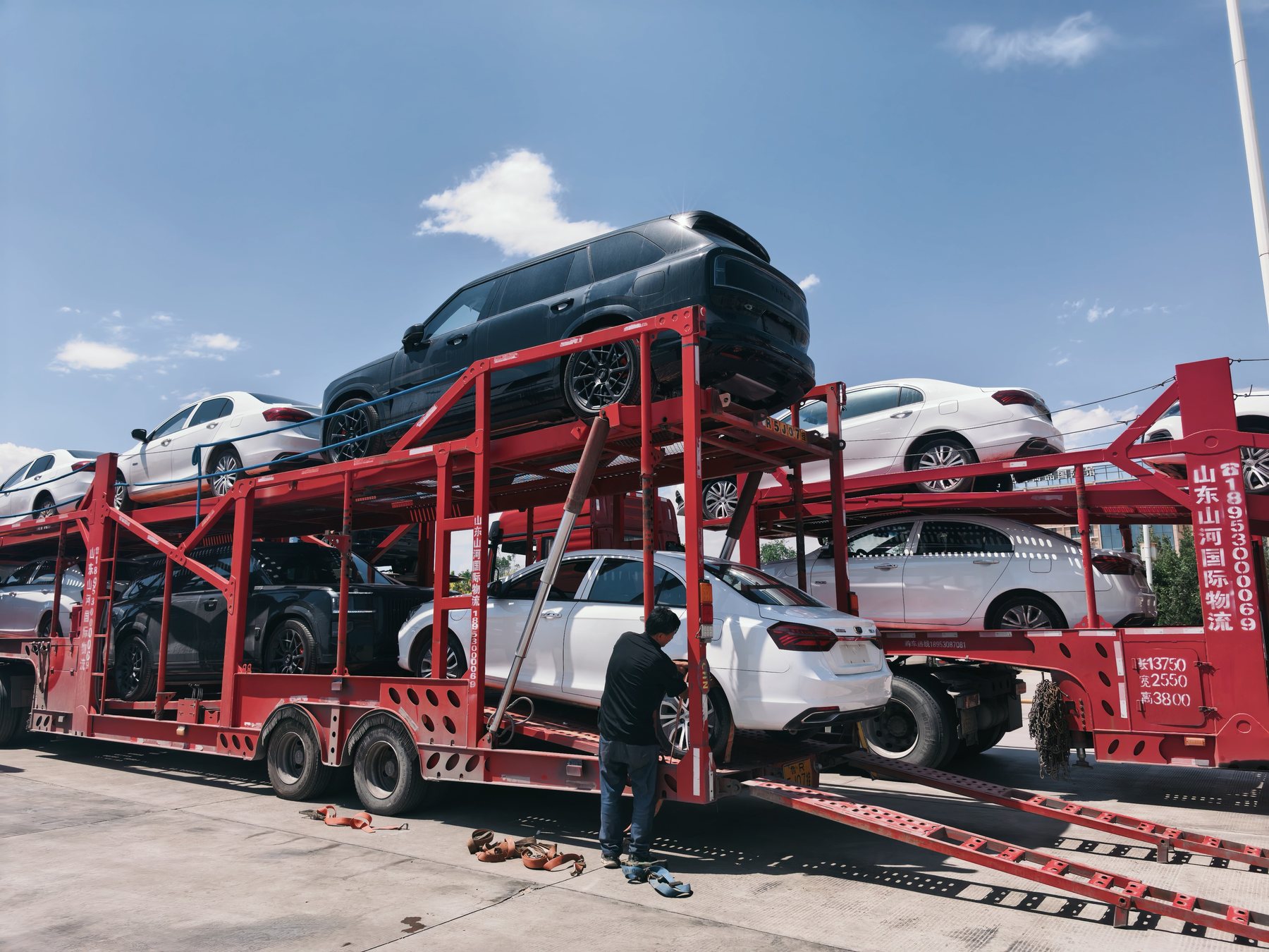 Export vehicles secured on a double-deck car carrier before dispatch